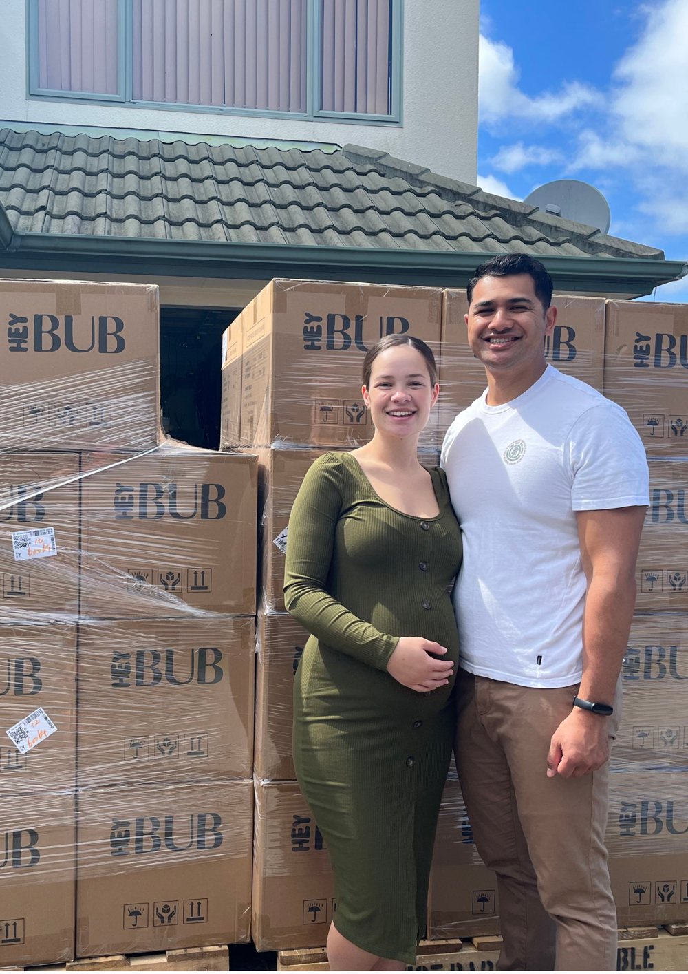 Talmage and his wife in front of a shipment of Hey Bub boxes